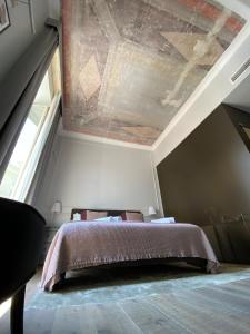 A bed or beds in a room at Holidays Suites Navona