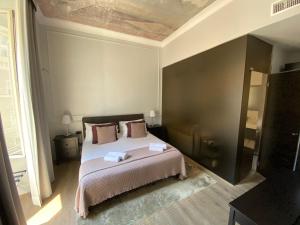 A bed or beds in a room at Holidays Suites Navona