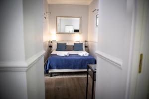 A bed or beds in a room at Holidays Suites Navona