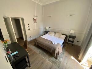 A bed or beds in a room at Holidays Suites Navona