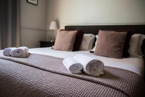 A bed or beds in a room at Holidays Suites Navona