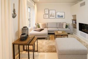 a living room with a couch and a table at Ferienhaus Inselwind Sylt in Westerland (Sylt)