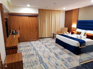 Säng eller sängar i ett rum på Oriental Residence