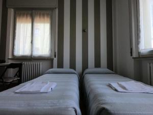 Postel nebo postele na pokoji v ubytování Gardenia Guest House