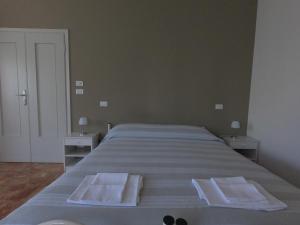 Postel nebo postele na pokoji v ubytování Gardenia Guest House