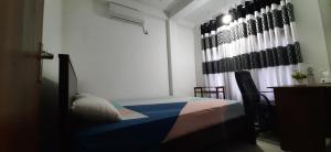 Letto o letti in una camera di Mangohut Joy