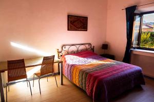Posteľ alebo postele v izbe v ubytovaní Appartamento Villa Matone + 19 fotografií