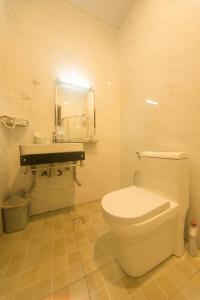 A bathroom at AVISHA TOWN HOTEL