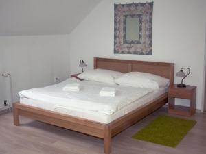 
Postel nebo postele na pokoji v ubytování Penzion u Rudolfa

