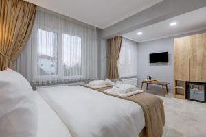 Ένα ή περισσότερα κρεβάτια σε δωμάτιο στο Sapanca View Hotel