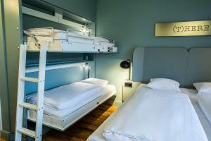 a bunk bed room with two beds and a ladder at Scandic Silkeborg in Silkeborg