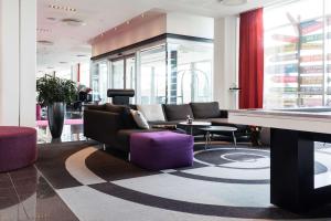 a lobby with a couch and a table at Scandic Sluseholmen in Copenhagen