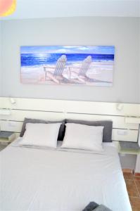 A bed or beds in a room at Apartamentos Sarah