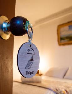 a key chain attached to a door with a picture of a mushroom at NOGAL HOSTEL in Pereira