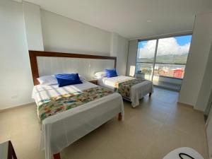 Hotel Santorini客房内的一张或多张床位