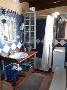 a bathroom with a sink and a shower at CASA TAMARA APalmera BDátil in Haría +32 photos