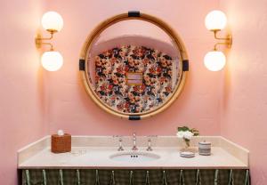 a bathroom with a sink and a mirror at Palihouse Santa Barbara in Santa Barbara