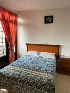 Postel nebo postele na pokoji v ubytování Hotel Posada de Belen