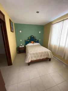 Voodi või voodid majutusasutuse Hotel Posada de Belen toas