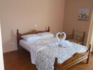 Kostas Family House tesisinde bir odada yatak veya yataklar