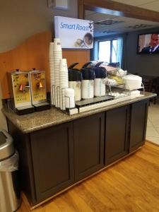 a counter with toiletries on it in a room at Holiday Inn Express Tucson-Airport, an IHG Hotel in Tucson