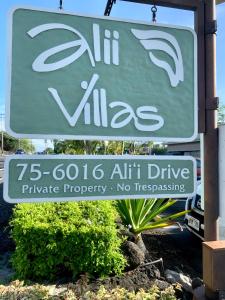 a green and white sign for a vitz clinic at Enjoy the sunset at OCEAN FRONT 1BR Apartment - pool on site! in Kailua-Kona