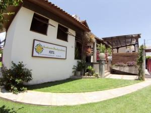 a house with a sign on the side of it at Sunhouse Hostel in Florianópolis