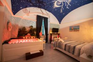 a bedroom with a bed and a star ceiling at Stabiae Luxury Room in Castellammare di Stabia