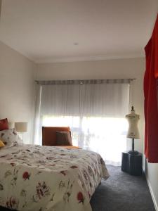 A bed or beds in a room at Wotama, Macedon B and B, Honour Ave, Mount Macedon