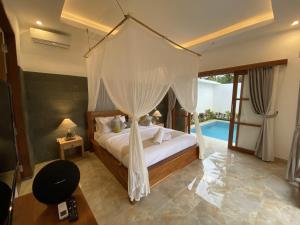 Кровать или кровати в номере Luxury Villa Ada Padi Ubud one bed room