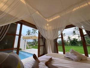 Кровать или кровати в номере Luxury Villa Ada Padi Ubud one bed room