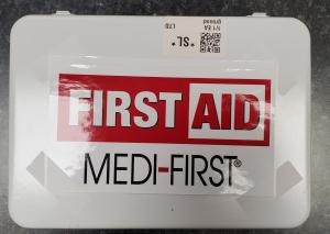 a sign that says first aid meld first at Anaheim National Inn in Anaheim