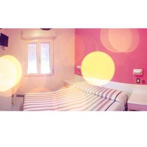 Postel nebo postele na pokoji v ubytování Hotel Zenit
