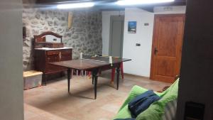 a dining room with a ping pong table in it at Apartament casa Rural Cal Xico d'Adrall -La Seu d'Urgell-Andorra in Adrall +66 photos