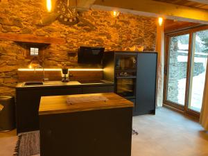 a kitchen with a sink and a counter top at chalet la grange in Tignes