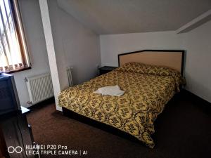 Ένα ή περισσότερα κρεβάτια σε δωμάτιο στο Ribkata Family Hotel