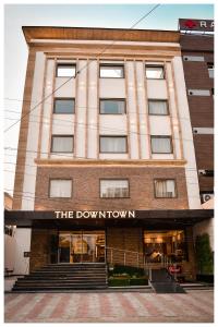 a building with the down town sign on it at THE DOWNTOWN in Kānpur