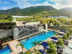 an aerial view of the resort with mountains in the background at Novotel Citygate Hong Kong in Hong Kong