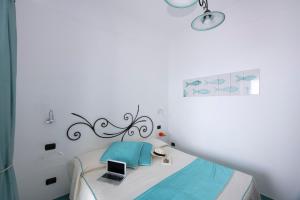 Postel nebo postele na pokoji v ubytování Hotel La Ninfa