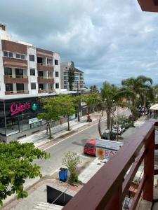 a view of a city street from a balcony at Canascenter Apart Hotel in Florianópolis