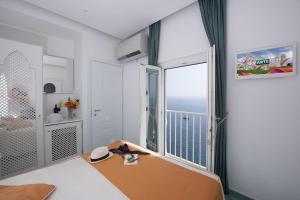 Postel nebo postele na pokoji v ubytování Hotel La Ninfa