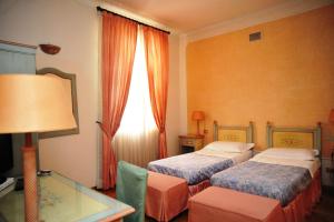 En eller flere senger på et rom på Villa Icidia