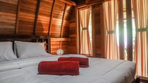 Postel nebo postele na pokoji v ubytování Lumbung Temu Homestay