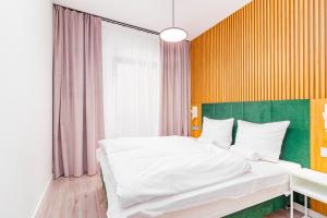 Posteľ alebo postele v izbe v ubytovaní Boogie Apartments