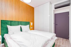 Posteľ alebo postele v izbe v ubytovaní Boogie Apartments