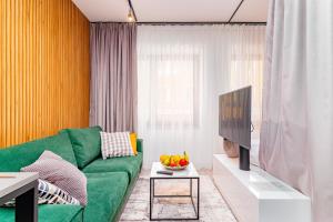 Televízia a/alebo spoločenská miestnosť v ubytovaní Boogie Apartments