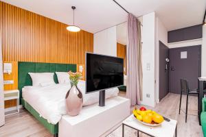 Televízia a/alebo spoločenská miestnosť v ubytovaní Boogie Apartments