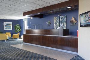a lobby with a reception desk in a hospital at Seaport Resort and Marina in Fairhaven +34 photos