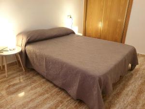Posteľ alebo postele v izbe v ubytovaní Apartamento Guardamar Playa