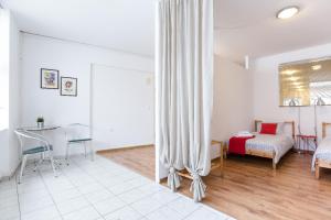 Posteľ alebo postele v izbe v ubytovaní Driopon Apartment - Penthouse
